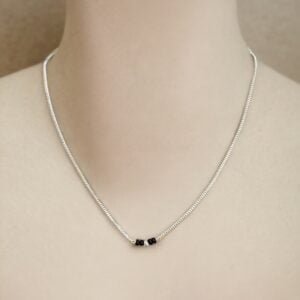 Minimalistic mangalsutra with longer black beads as pendants