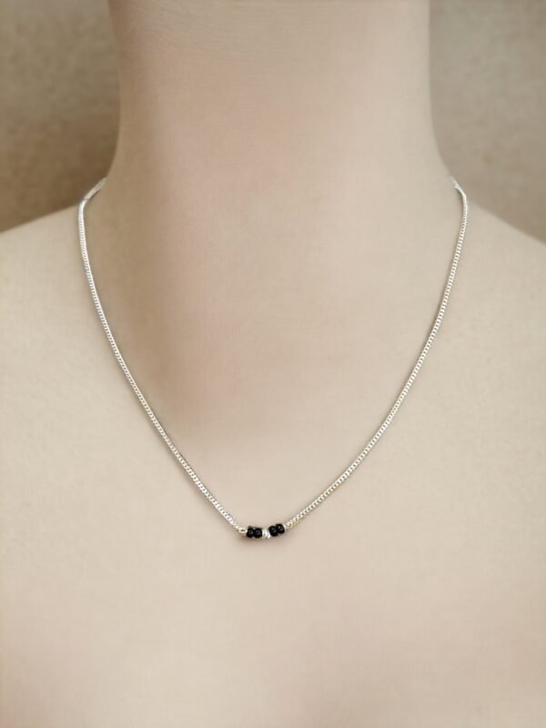 Minimalistic mangalsutra with longer black beads as pendants